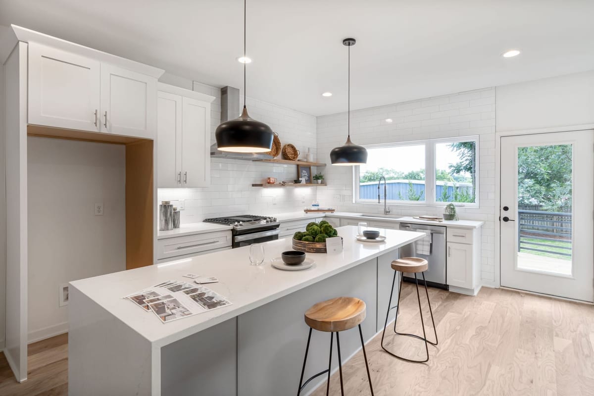 Newly fitted open-plan kitchen with timber cabinetry and a large island
